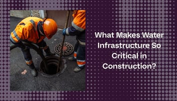 Construction workers inspecting a sewer manhole.